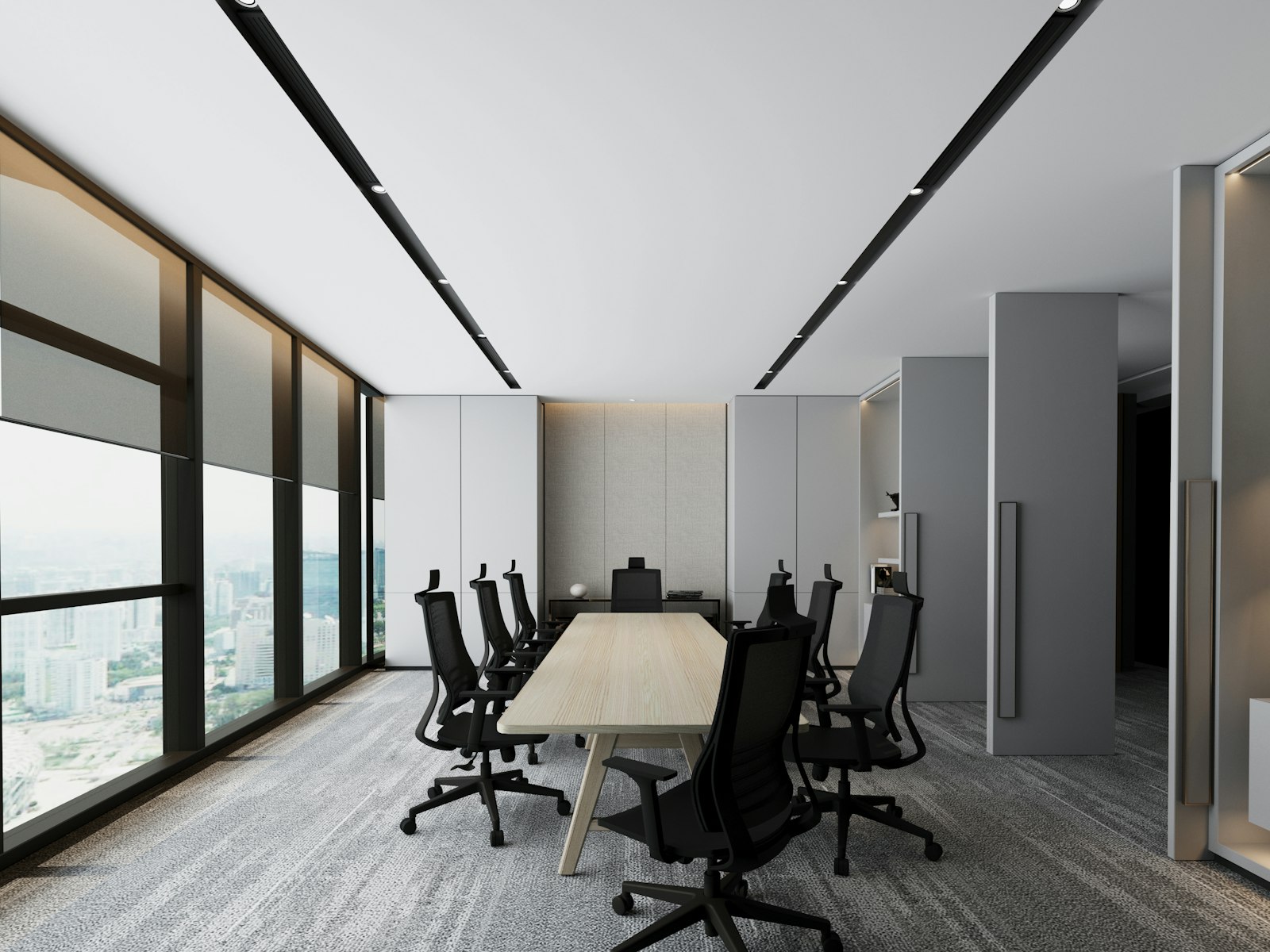 A meeting room lit by recessed linear ceiling fittings